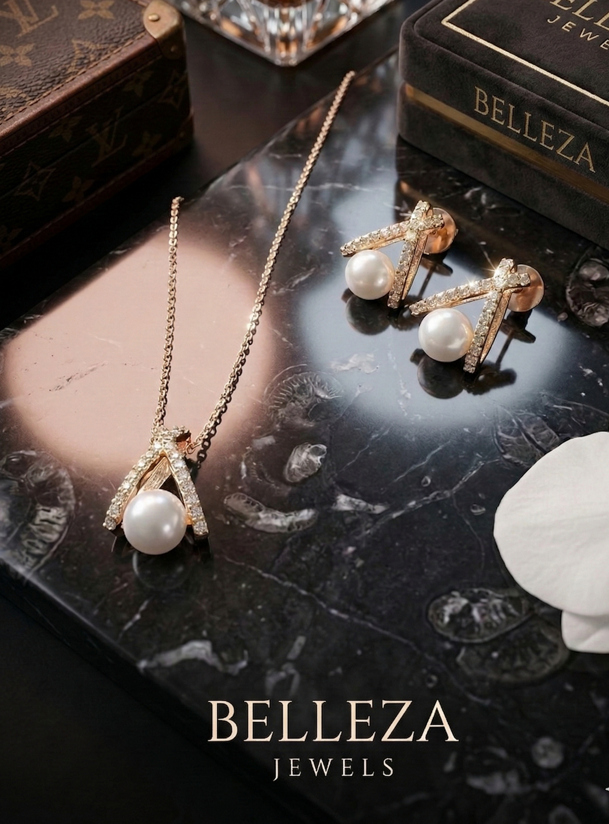 Pearl necklace and earrings with BELLEZA Jewels branding on a dark surface.
