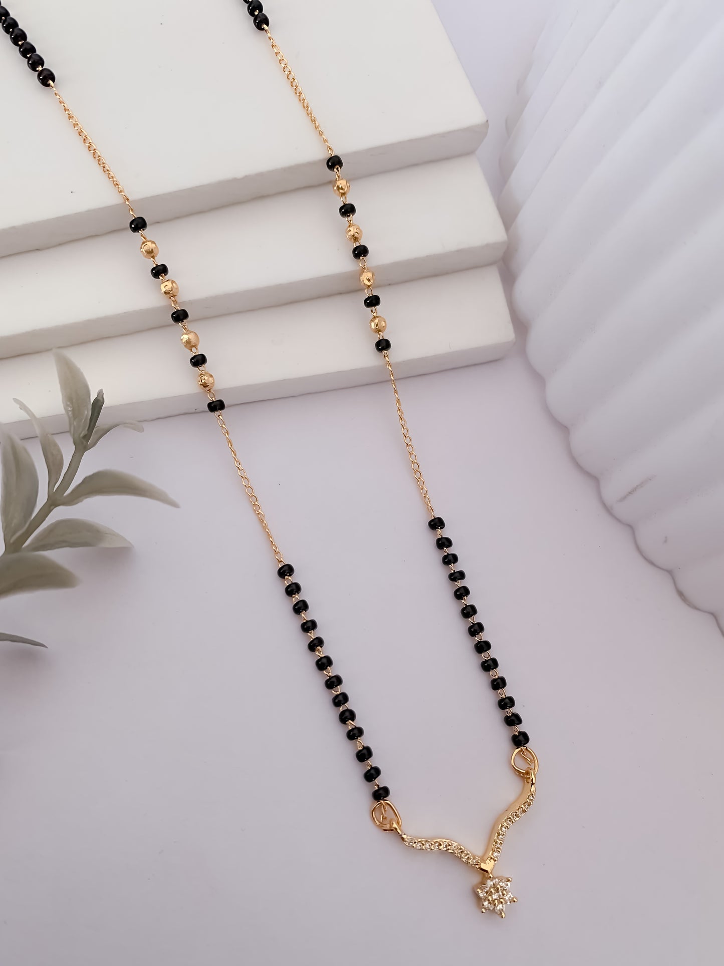 Buy 1 Get 1 Free -Gold Plated V-Shaped Crystal Pendant Mangalsutra with Black Beads - Mangalsutra - Belleza Jewels