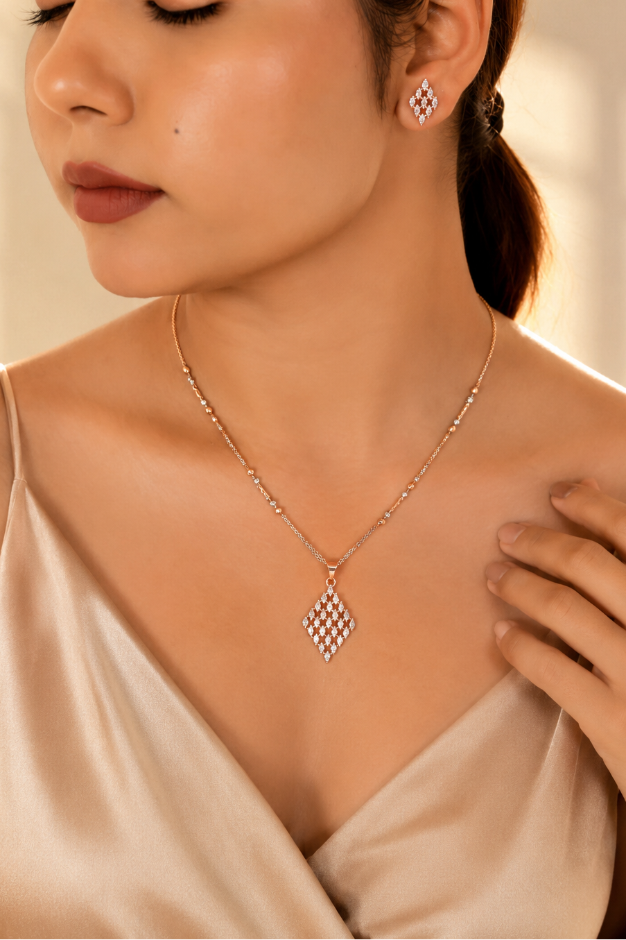Woman wearing a diamond necklace and earrings with a soft focus background