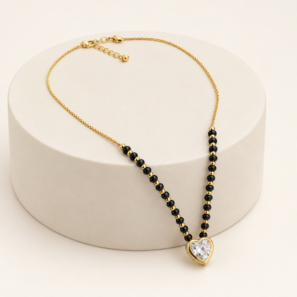 3702 mangalsutra displayed on an ivory plinth