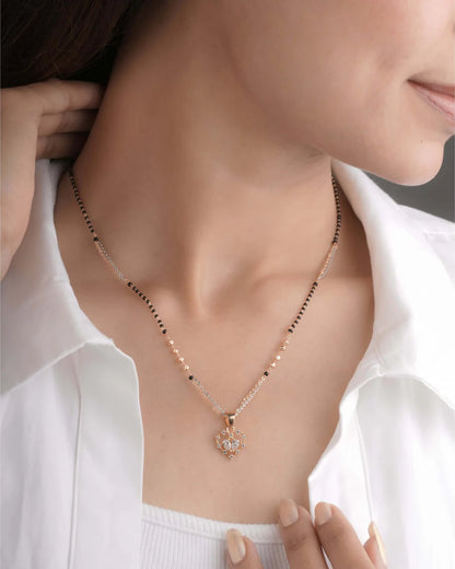 Mangalsutra with a heart pendant worn by a person in a white shirt - Belleza Jewels