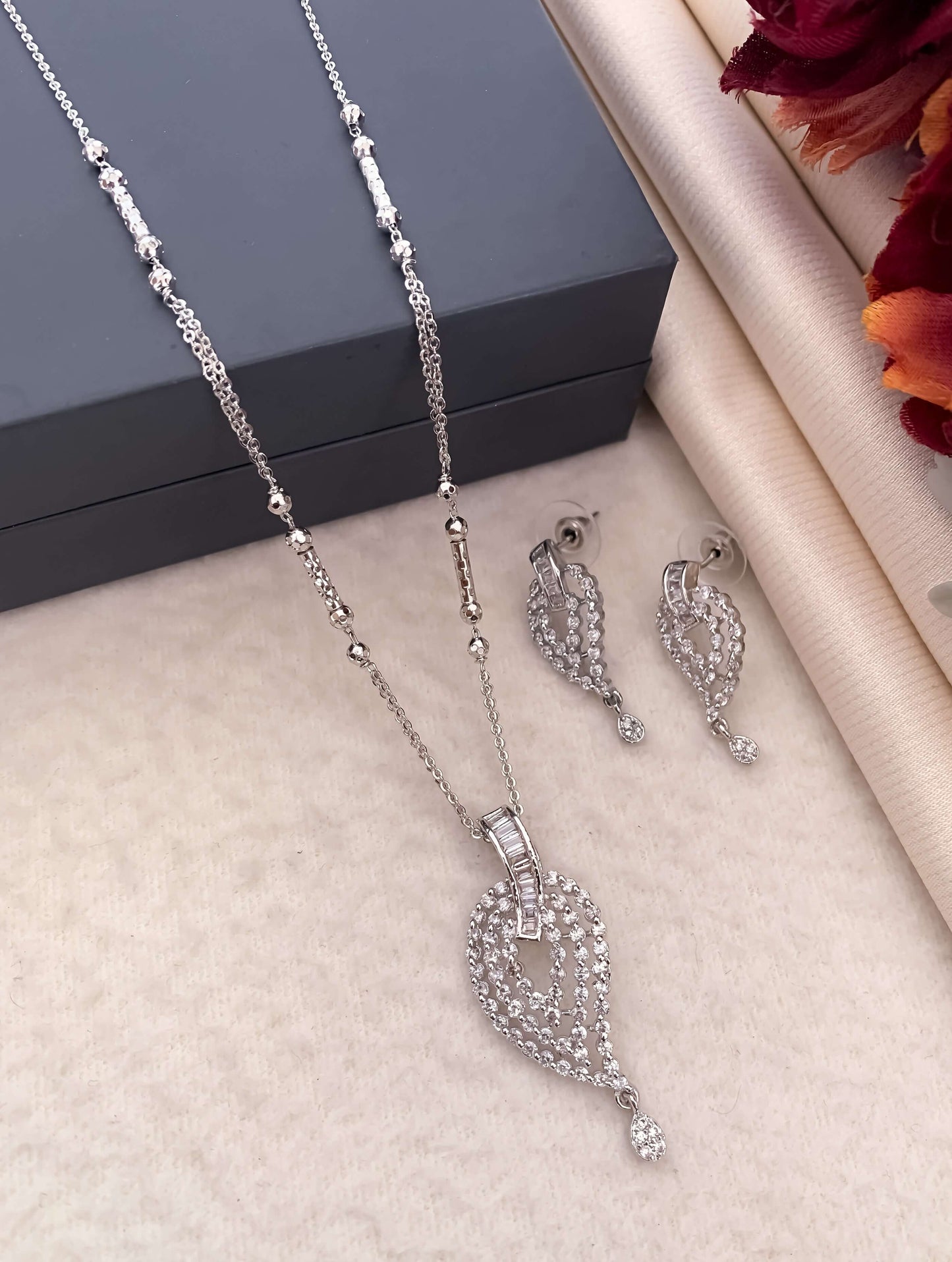 Silver Keri design three layer American diamond Pendant set with Earrings