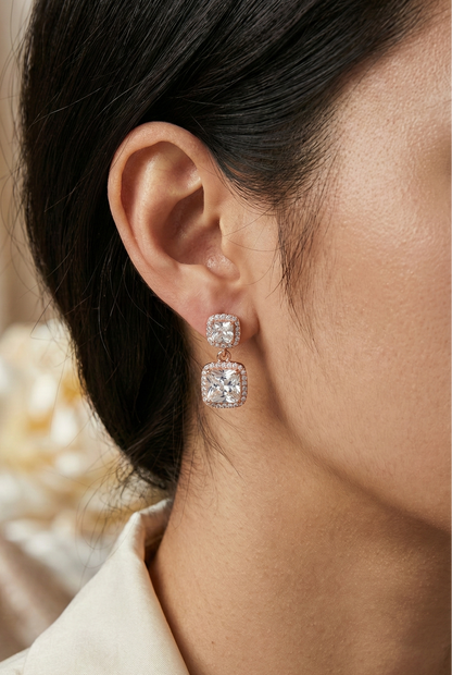 Close-up of a person wearing a diamond earring with a soft blurred background