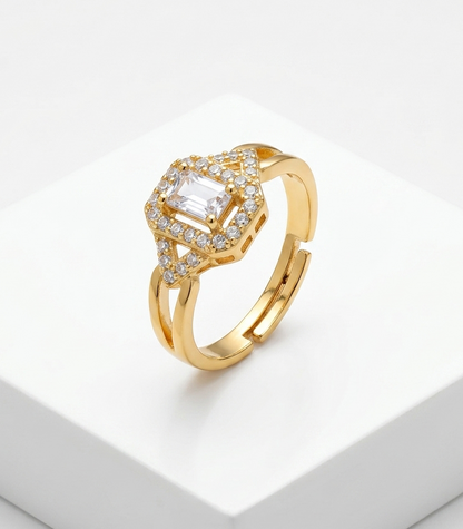 Gold ring with a diamond on a white background
