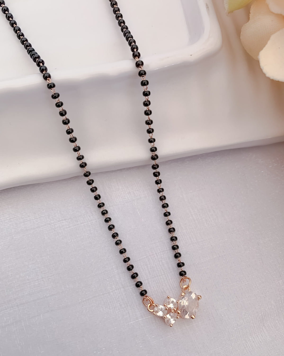 Buy 1 Get 1 Free -Minimal Gold Plated Black Bead Mangalsutra with Crystal Floral Center - Mangalsutra - Belleza Jewels