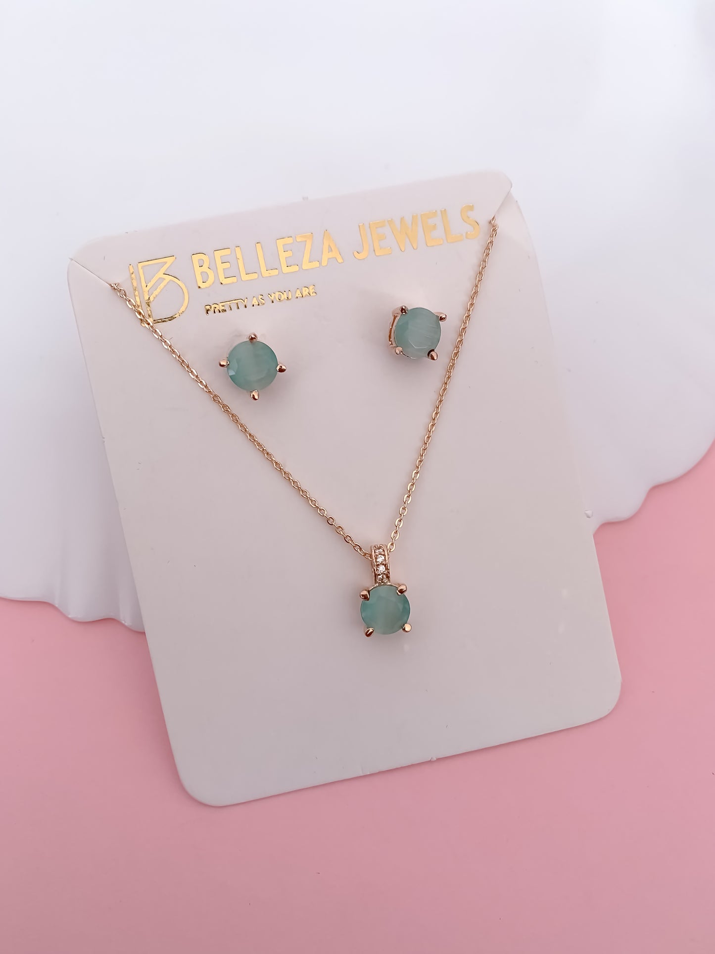 Elegant Aqua Stone Pendant Set in Rose Gold Finish