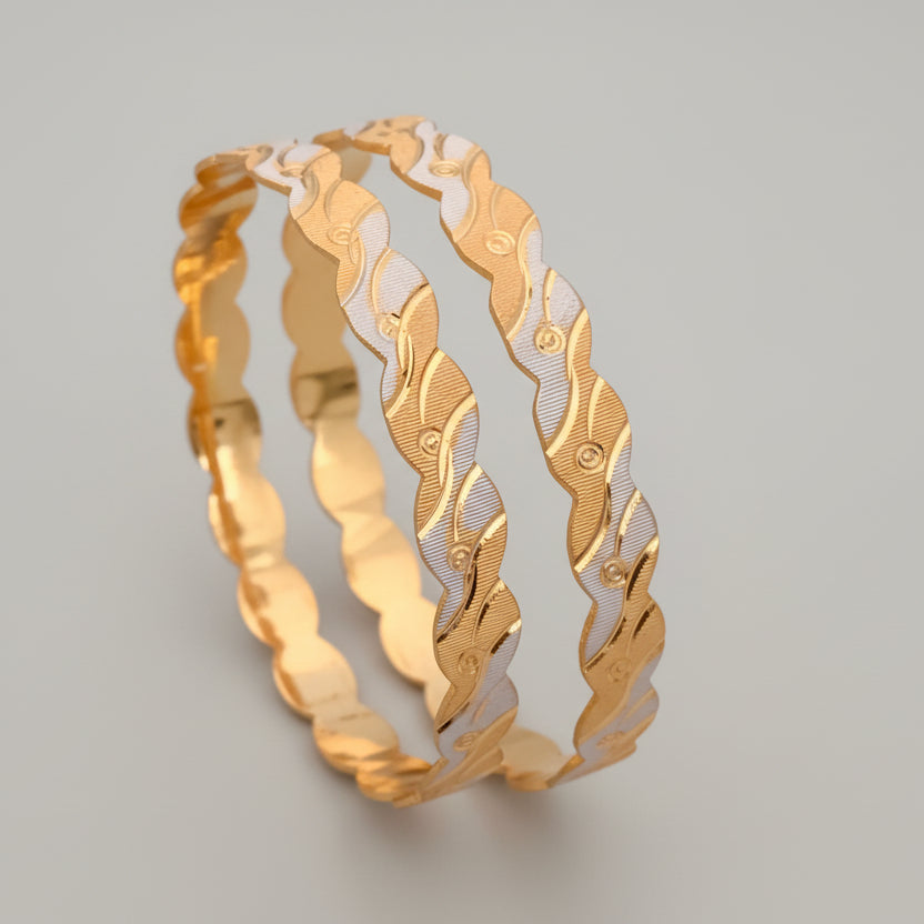 Gold and silver bangles on a pink background with flowers