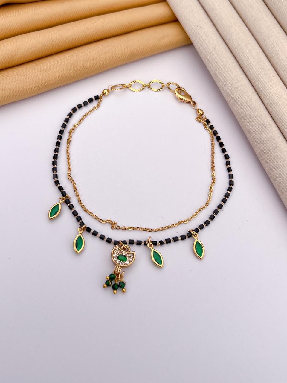 Green AD Stone with Black Beads & Gold Finish Mangalsutra Bracelet