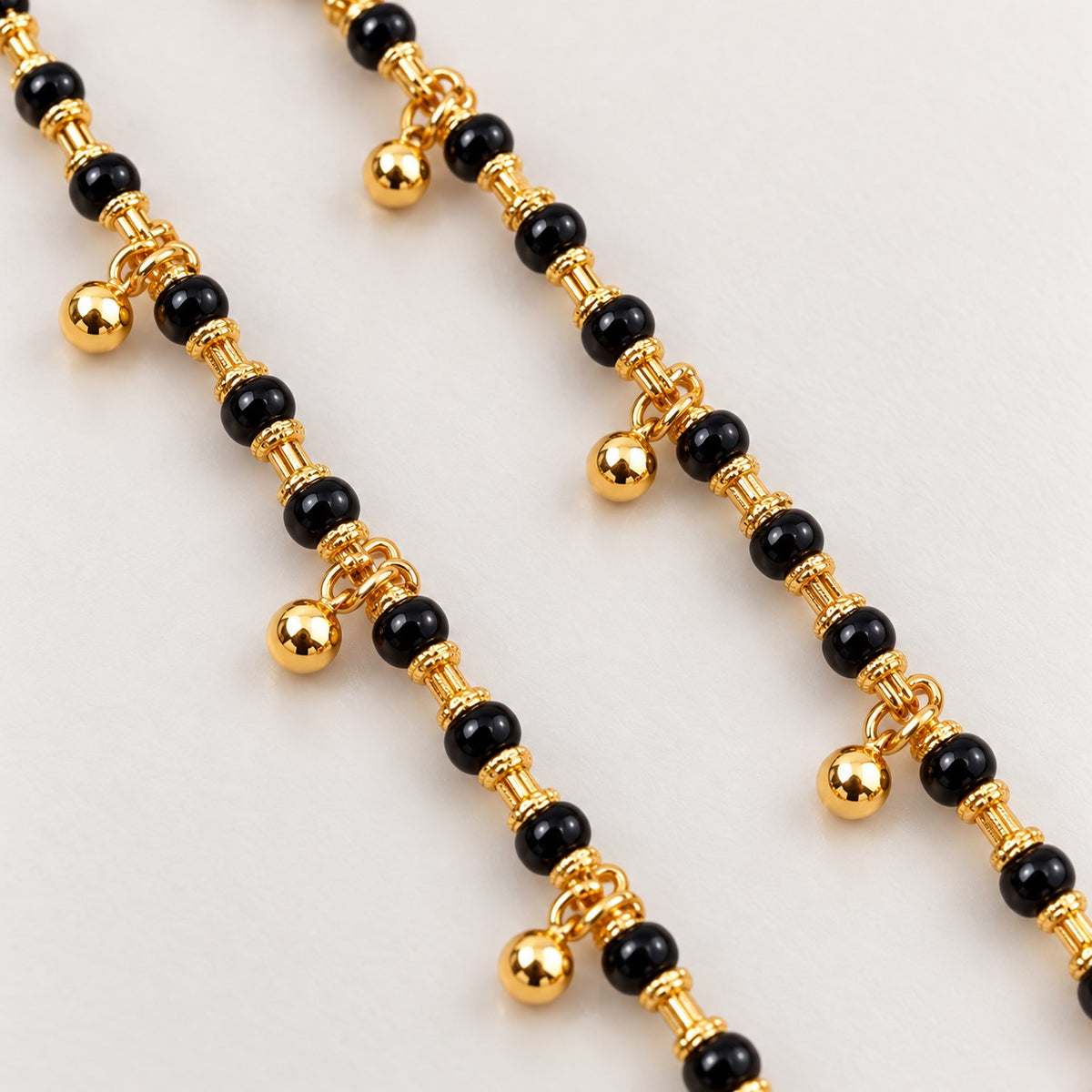 Fancy Black Beads with Golden Hanging Ball Najariya Bracelet