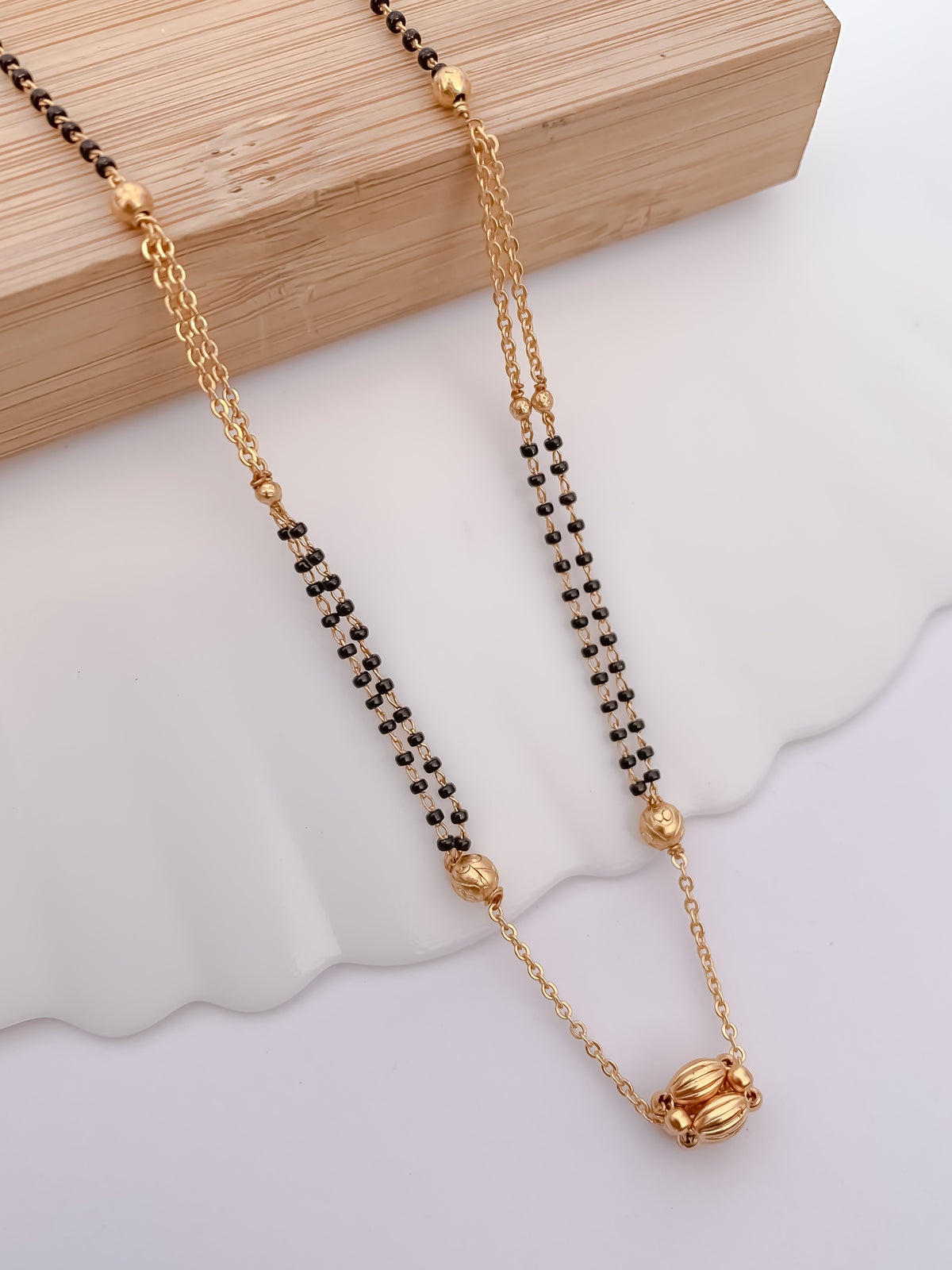 Double-Line Black Bead Mangalsutra with Textured Gold-Tone Bead Pendant