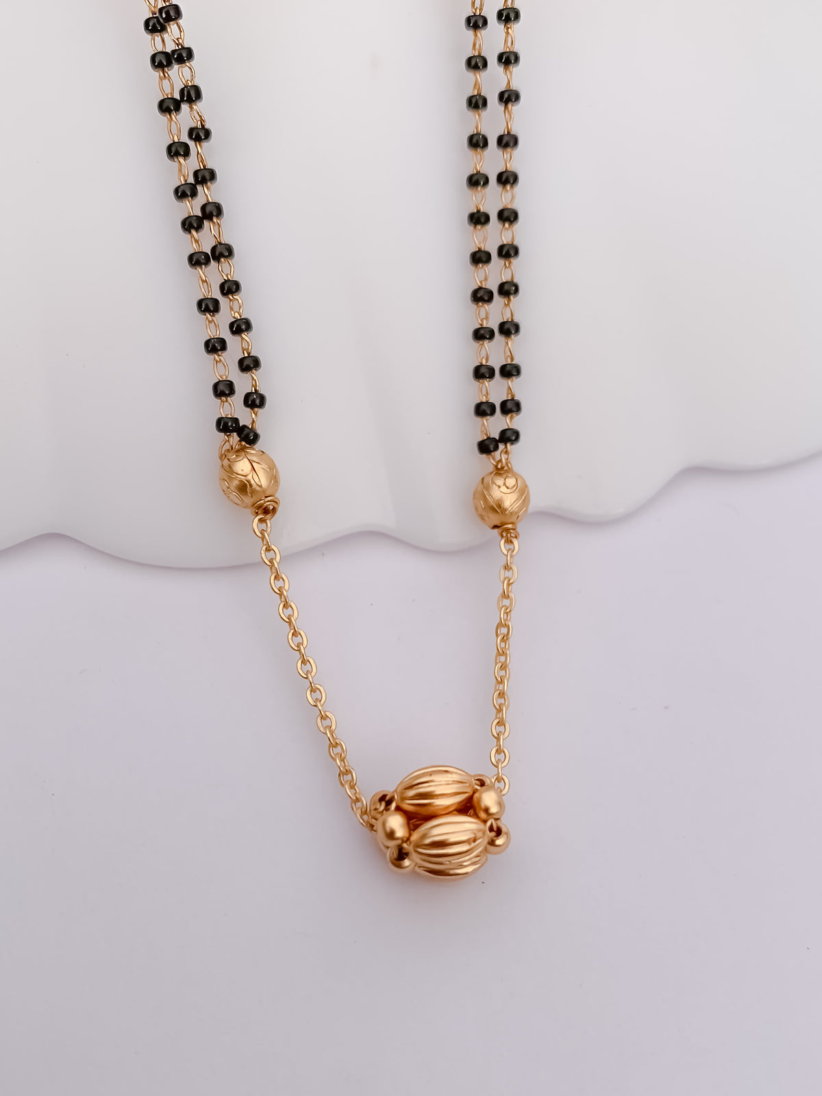 Double-Line Black Bead Mangalsutra with Textured Gold-Tone Bead Pendant
