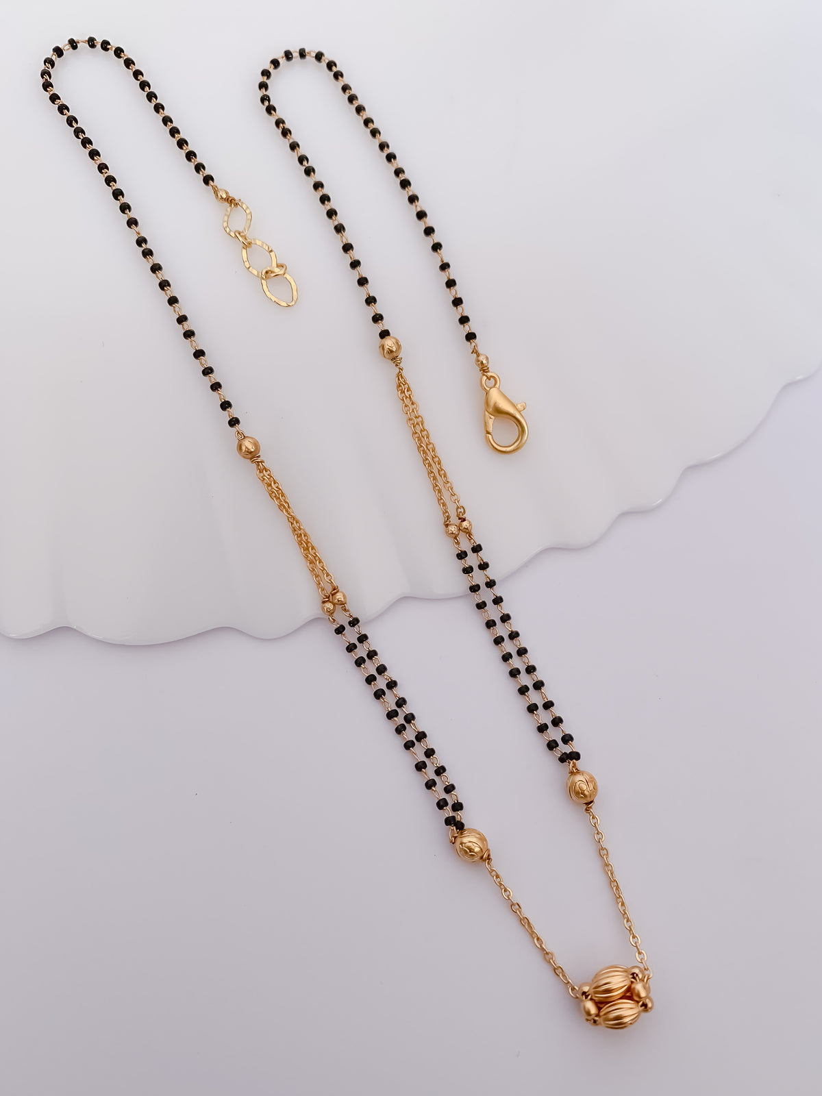 Double-Line Black Bead Mangalsutra with Textured Gold-Tone Bead Pendant