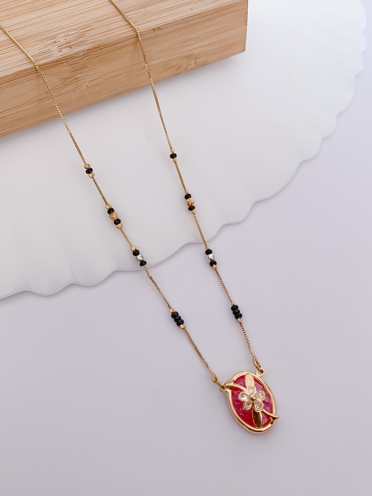 Ruby Oval Floral Black Bead Mangalsutra with Gold-Tone Pendant