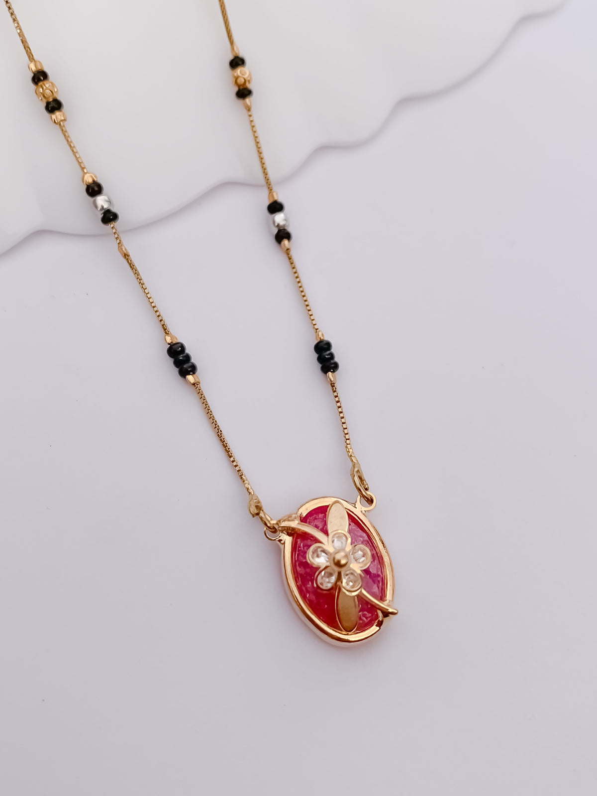 Ruby Oval Floral Black Bead Mangalsutra with Gold-Tone Pendant