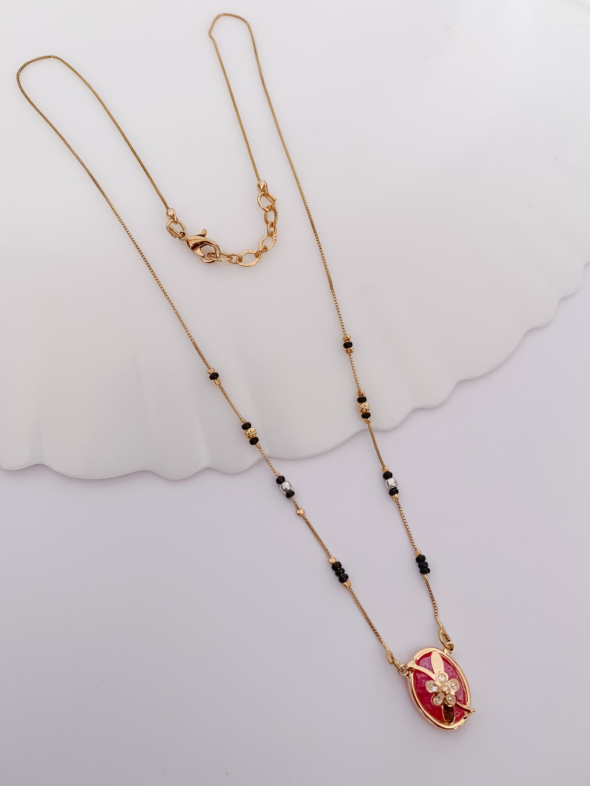 Ruby Oval Floral Black Bead Mangalsutra with Gold-Tone Pendant