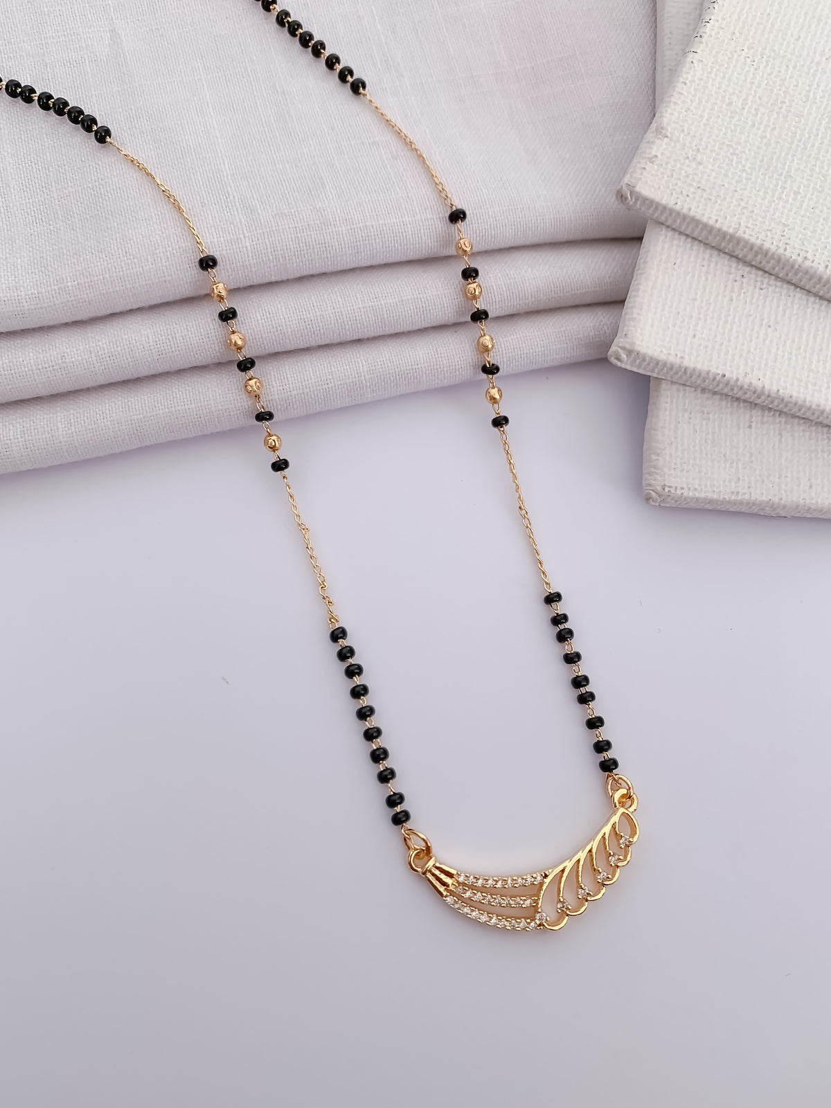 Wing Curve Black Bead Mangalsutra with Crystal Detail