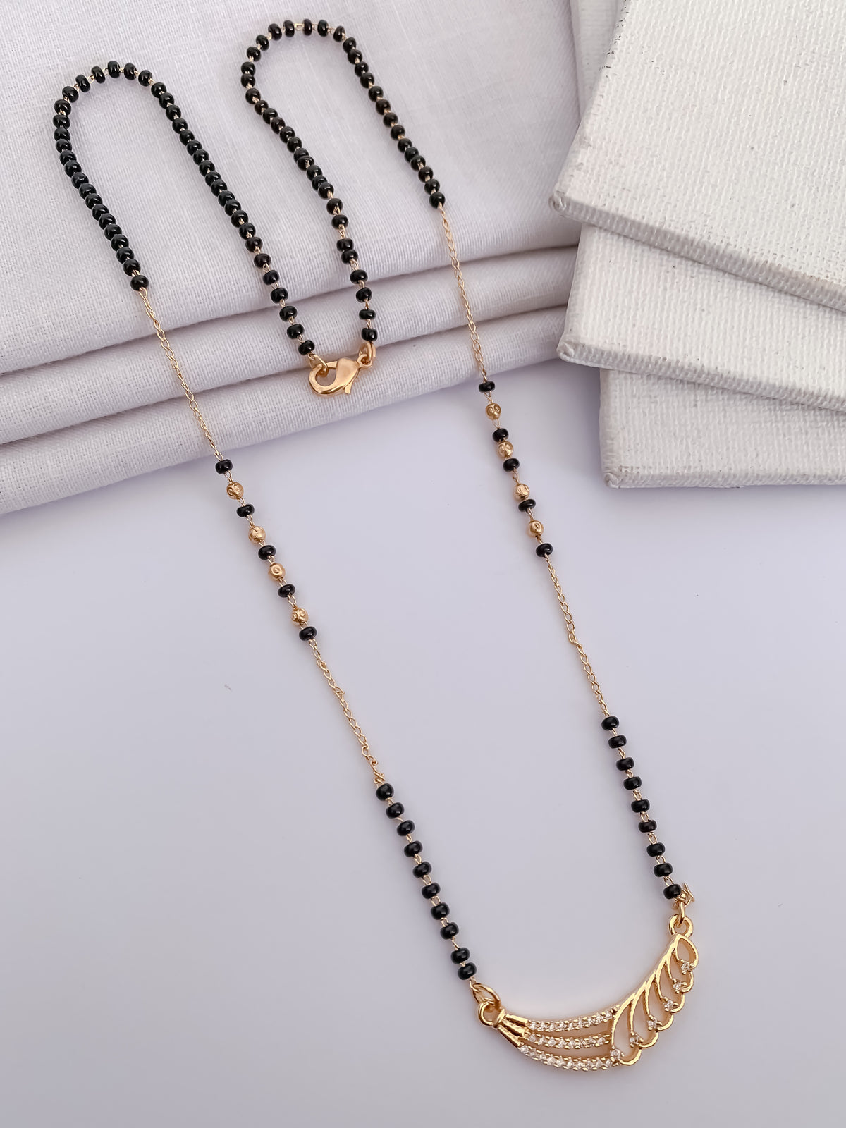 Wing Curve Black Bead Mangalsutra with Crystal Detail