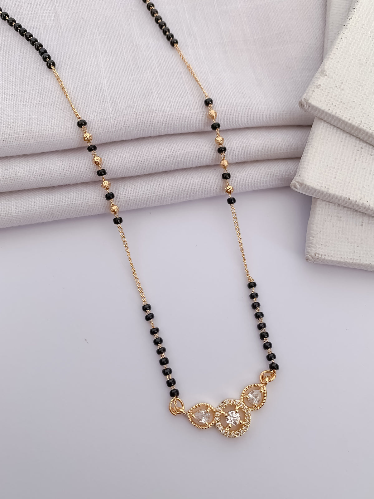 Triple Solitaire Black Bead Mangalsutra with Teardrop Halo Pendant