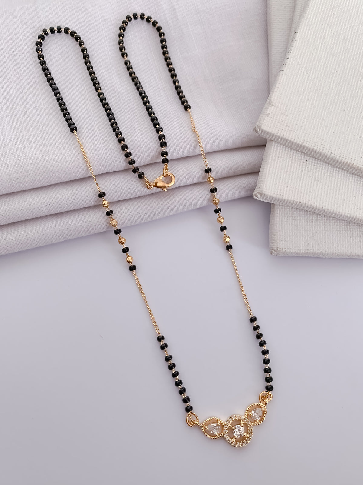 Triple Solitaire Black Bead Mangalsutra with Teardrop Halo Pendant