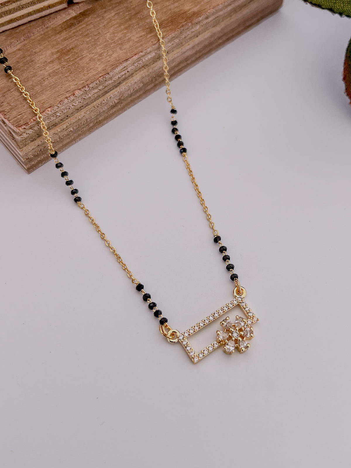 Geometric Floral Black Bead Mangalsutra with Crystal Square Pendant