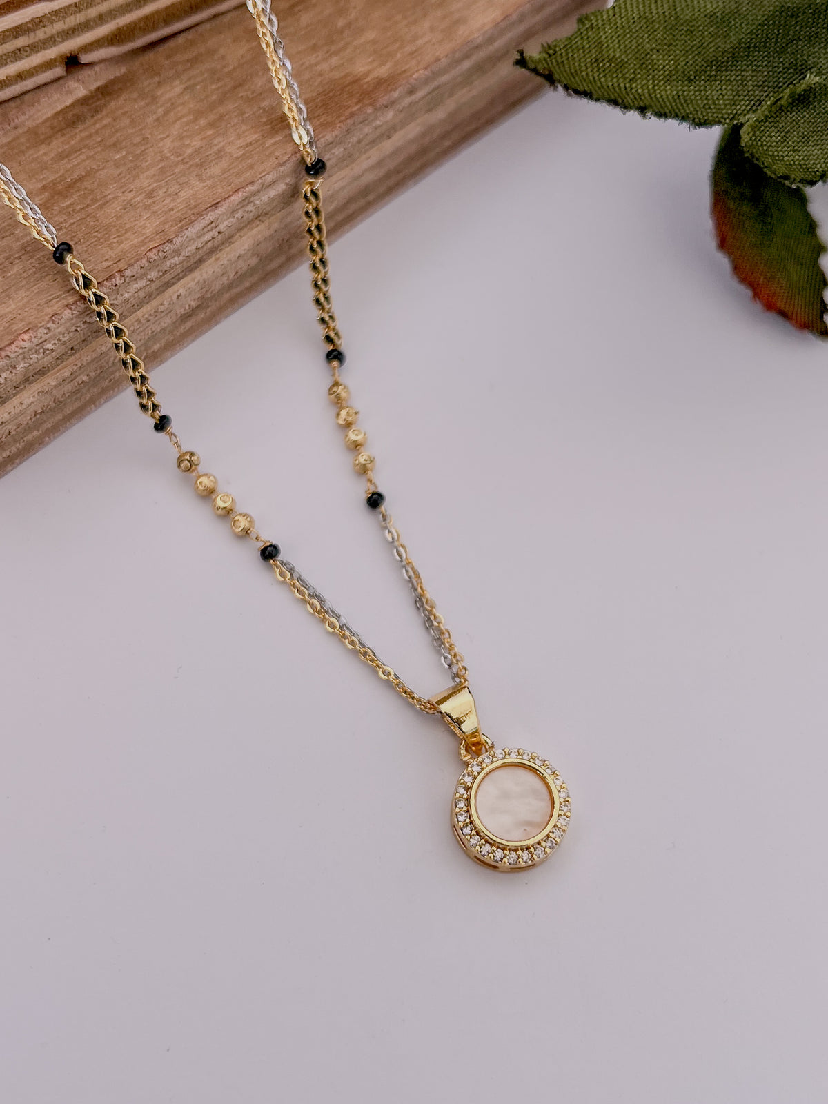 Two-Tone Round Halo Black Bead Mangalsutra with Pearl-Look Centre