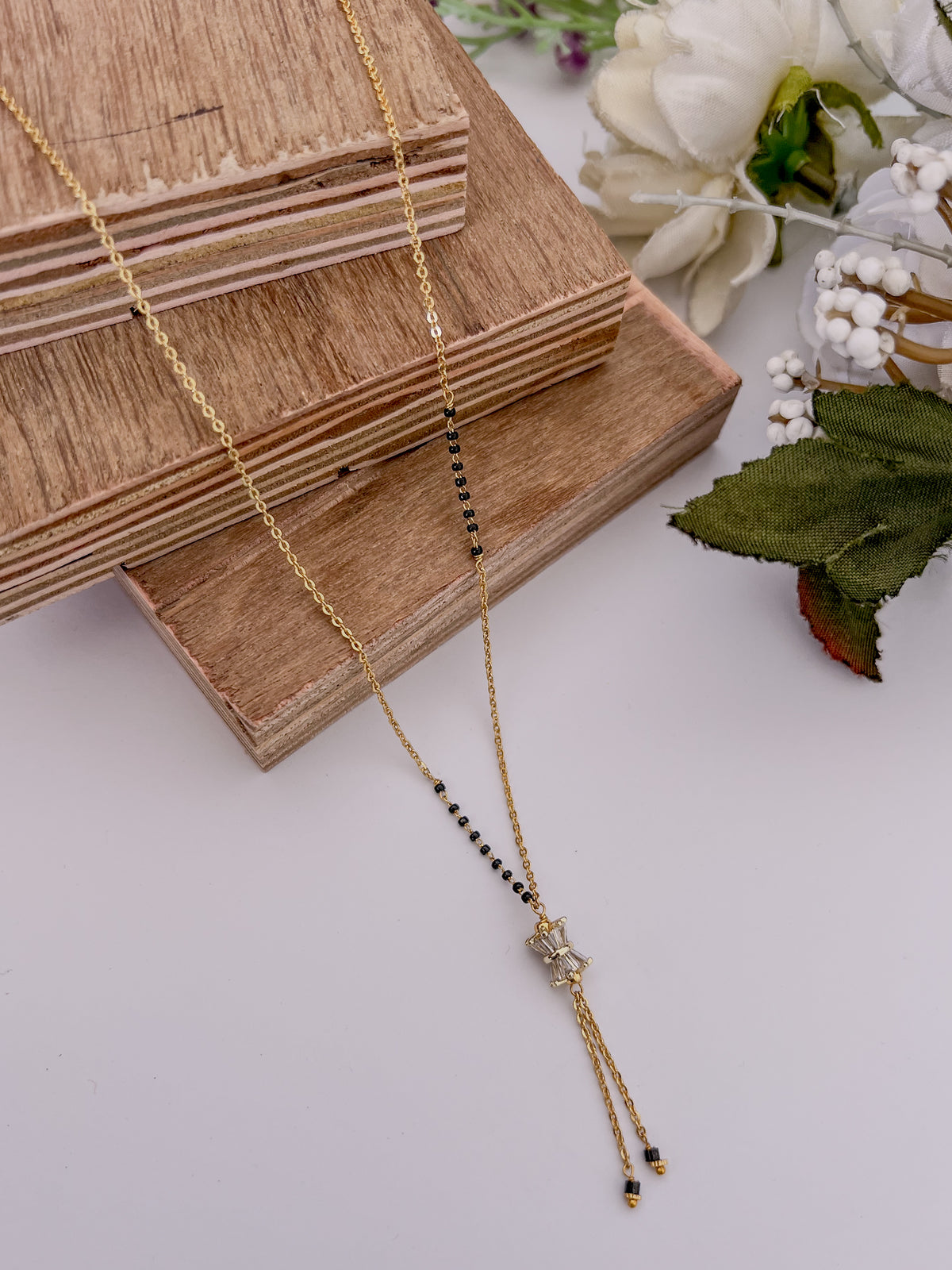 Bow Tassel Black Bead Mangalsutra with Crystal Detail