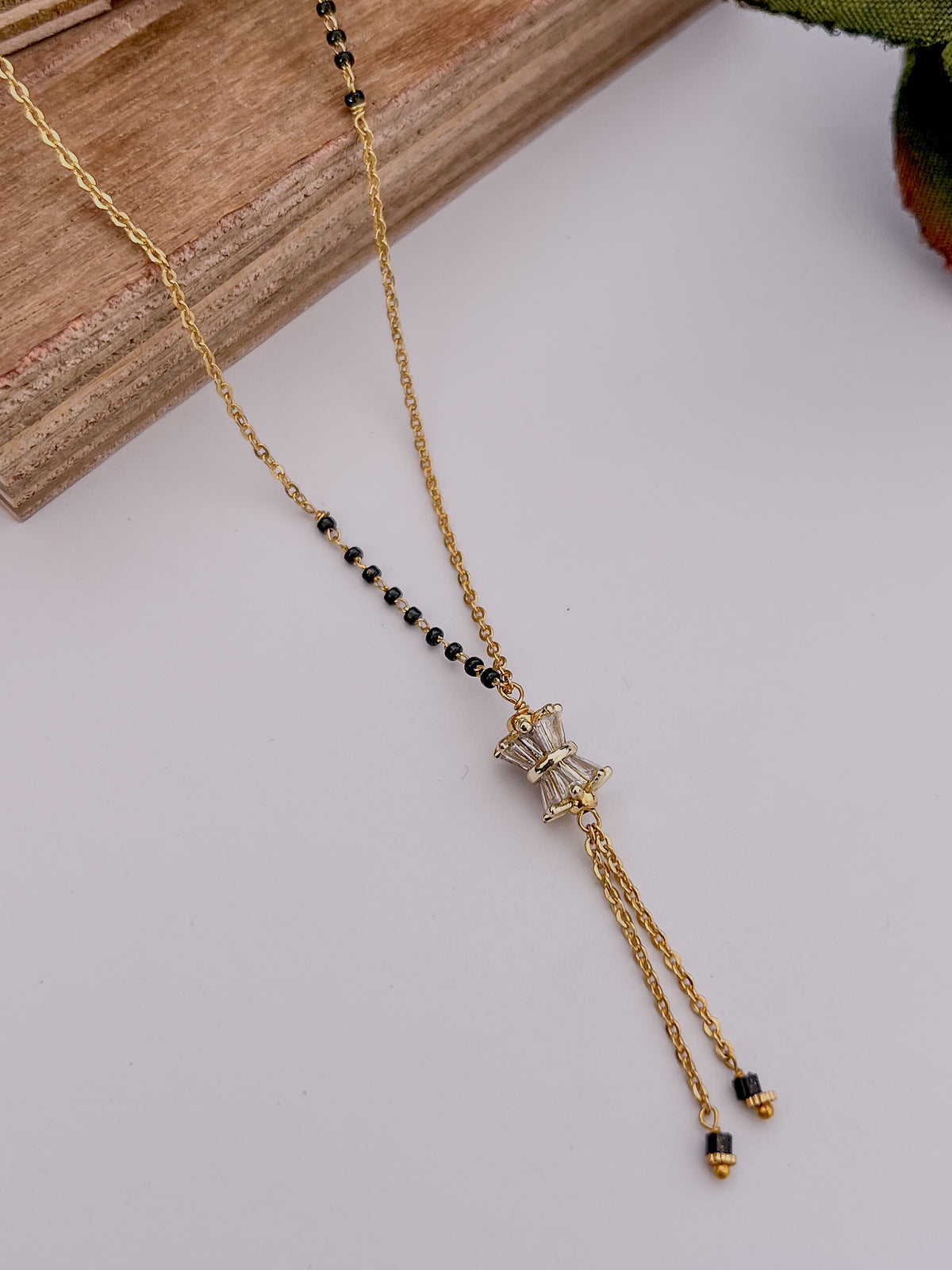 Bow Tassel Black Bead Mangalsutra with Crystal Detail