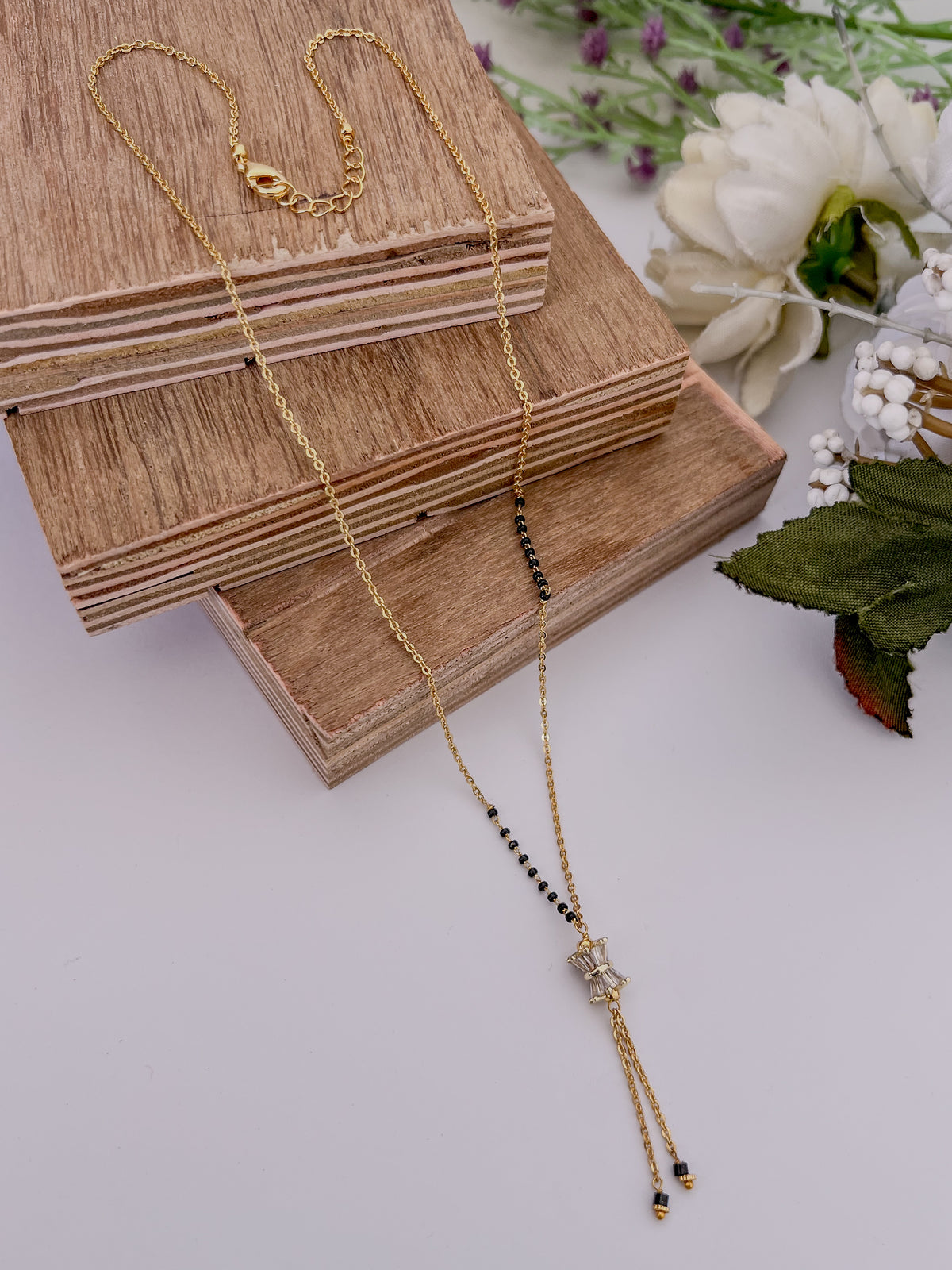 Bow Tassel Black Bead Mangalsutra with Crystal Detail