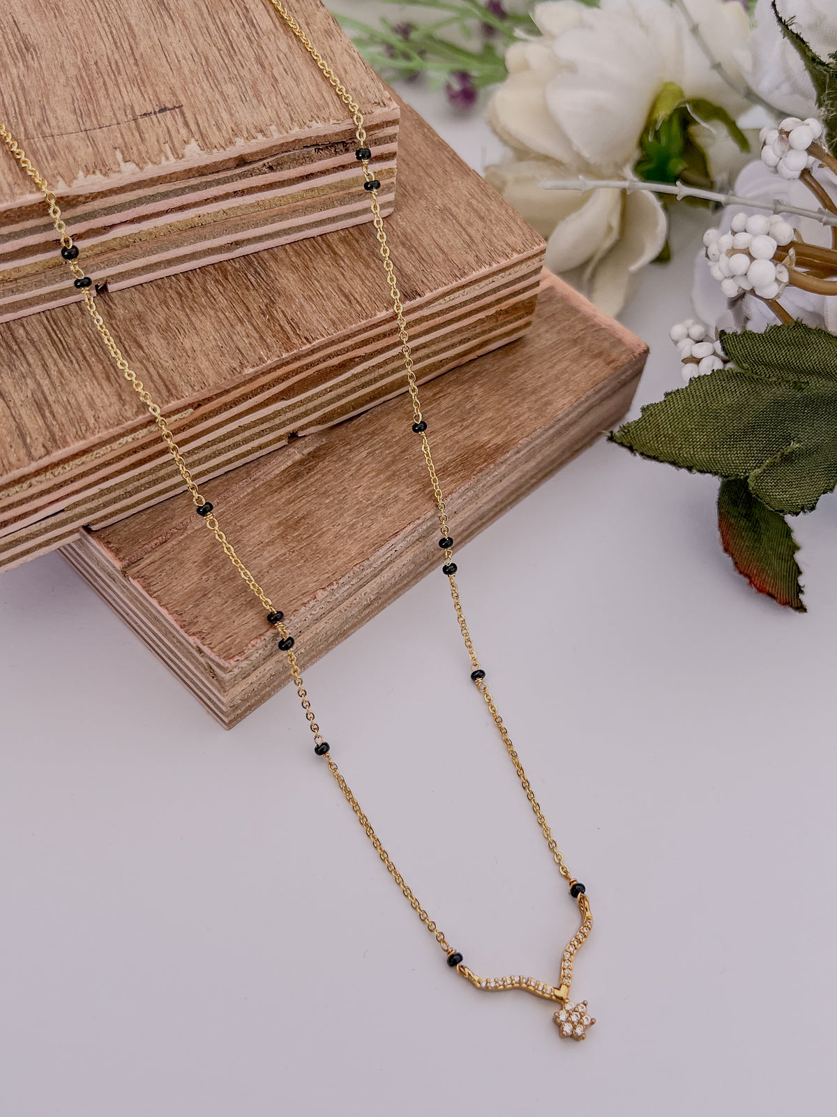 Floral Curve Black Bead Mangalsutra with Sparkle Drop