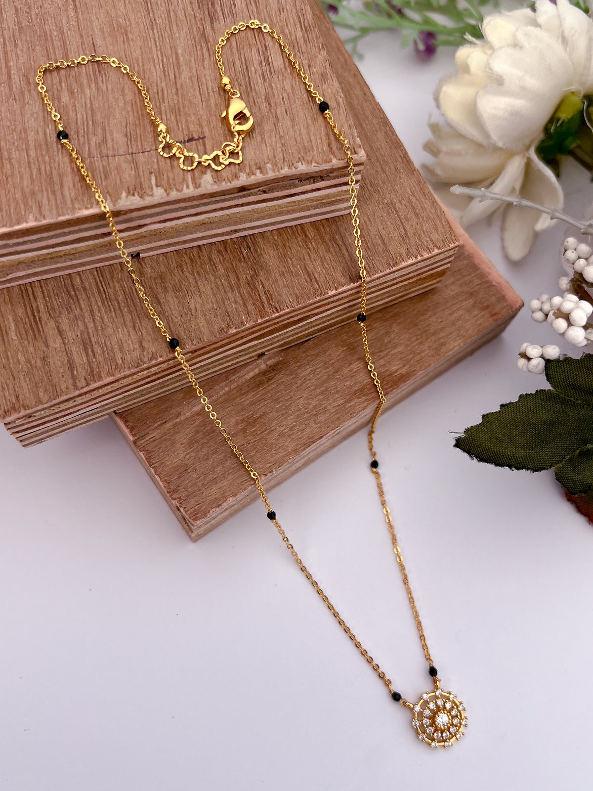Round Floral Halo Black Bead Mangalsutra with Solitaire Centre
