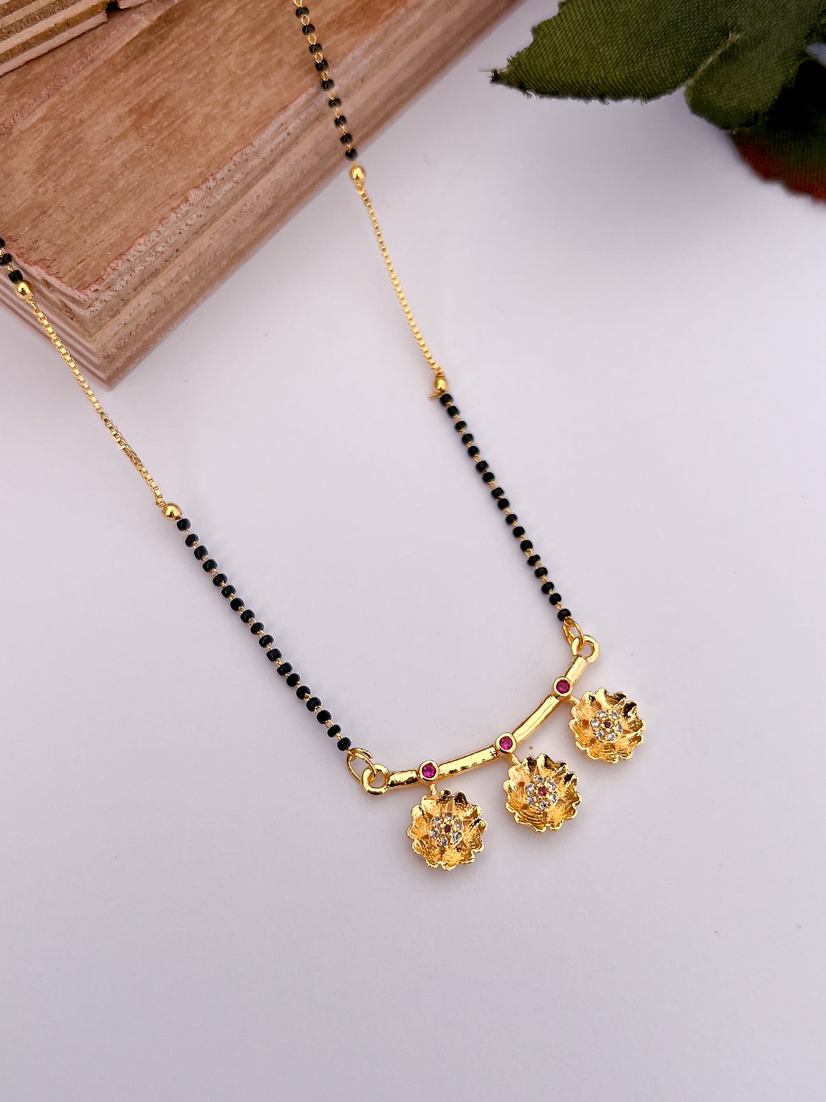 Floral Drop Black Bead Mangalsutra with Pink Stone Accents