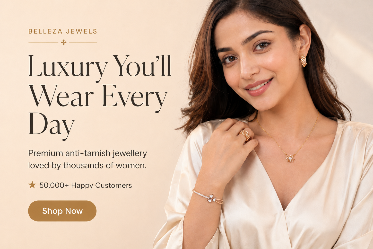 Promotional banner for Belleza Jewellery featuring a smiling woman in a cream satin top wearing delicate gold jewelry, including a necklace, bracelet, and ring. The left side contains text reading 'Luxury You'll Wear Every Day' and a 'Shop Now' button on a warm beige background.