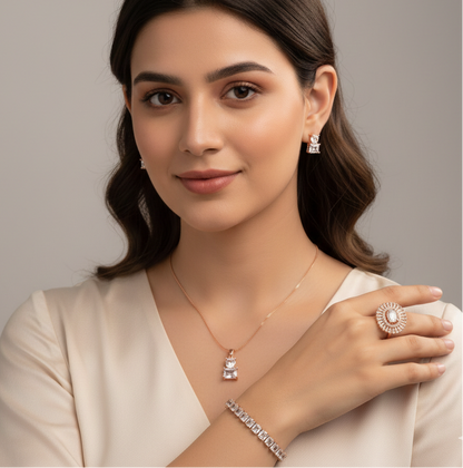 Woman wearing jewelry including a necklace, ring, and bracelet against a neutral background | Belleza Jewels