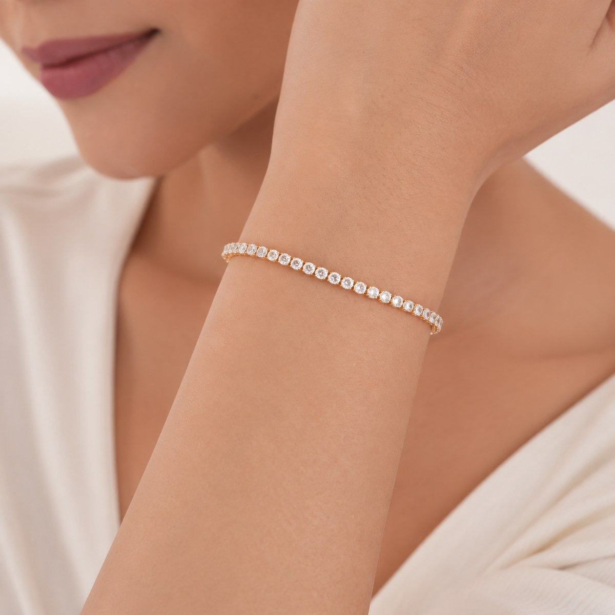 Round CZ Tennis Bracelet on wrist in warm ivory styling