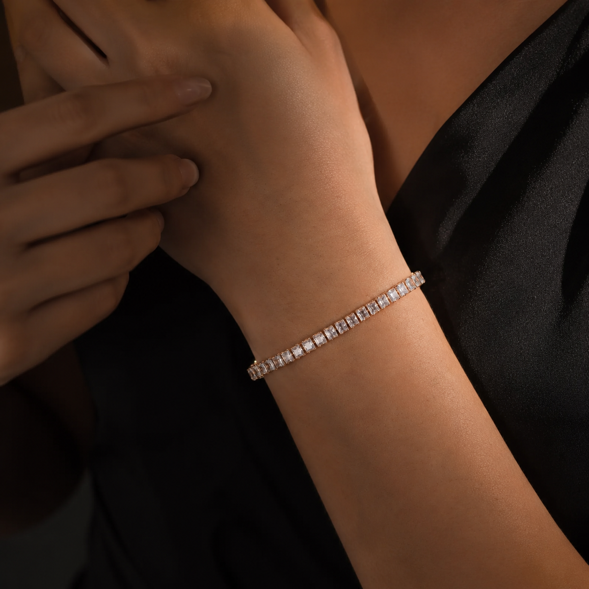 Rose gold baguette tennis bracelet styled for evening