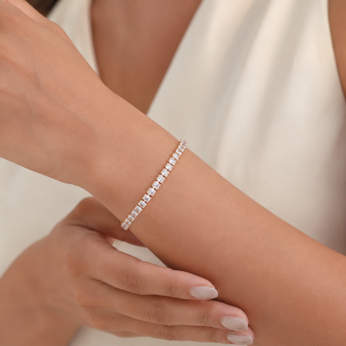 Baguette Stone Tennis Bracelet worn with an ivory outfit